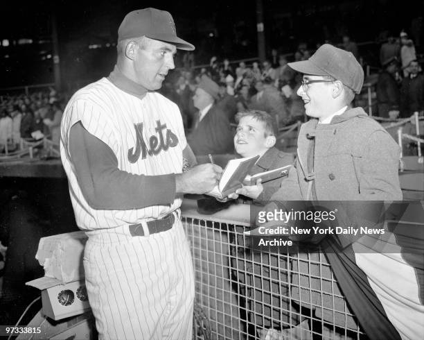New York Mets opening day at Polo Grounds. Laddie Ross and brother Arthur of Mamaroneck got thrill of a lifetime when outfielder Frank Thomas gave...