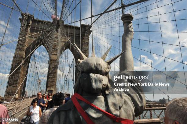 Owners of Vox Pop Coffee Shop where their Statue Liberty was stolen , picked up a new one provided by One if By Land, Two if By Sea Restuarant of...