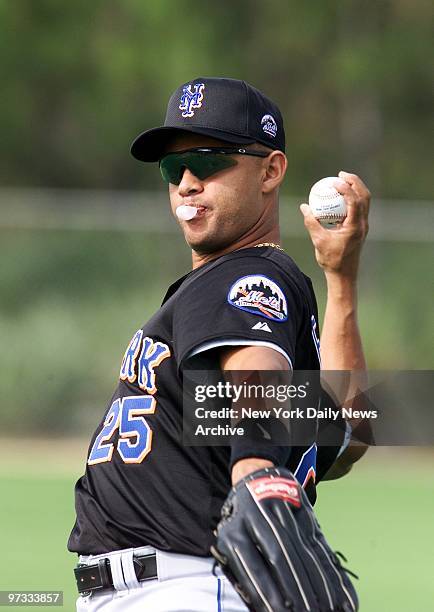 New York Mets' outfielder Alex Escobar warms up at a spring training practice session in Port St. Lucie, Fla.