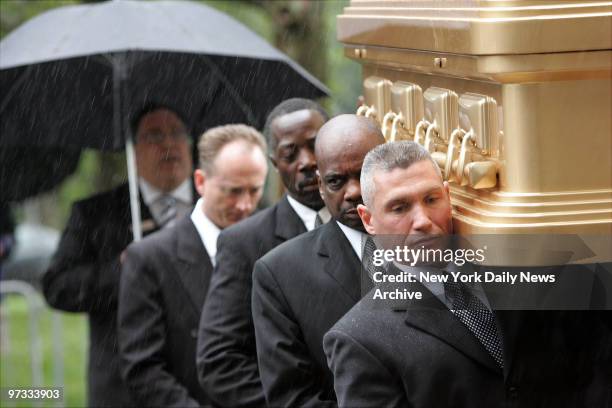 Pallbearers carry the coffin of Luther Vandross into the Riverside Church on the upper West Side for funeral services. The R&B legend, who suffered a...