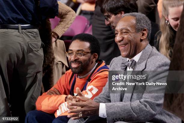 Director Spike Lee and funnyman Bill Cosby enjoy the action during the first half as the New York Knicks take on the Philadelphia 76ers at Madison...