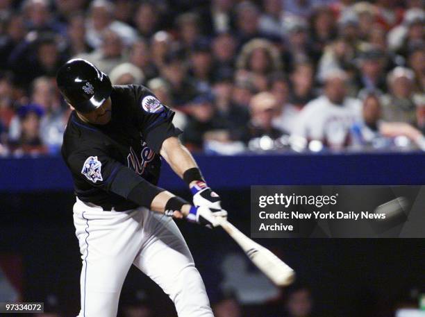 New York Mets' Mike Piazza hits a two-run homer in the bottom of the third inning of Game 4 of the World Sseries against the New York Yankees. The...