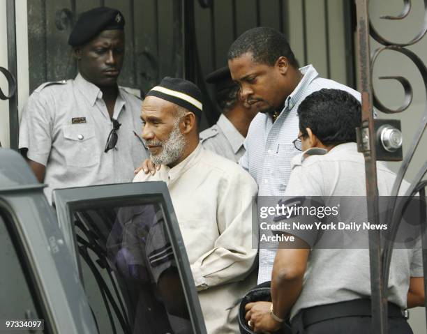 Terror suspect Kareem Ibrahim leaves Port-of-Spain Magistrate Court on the island of Trinidad, in handcuffs after he and alleged cohort Abdul Kadir...