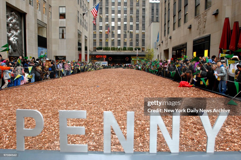 One million dollars in pennies are laid out in a massive pen