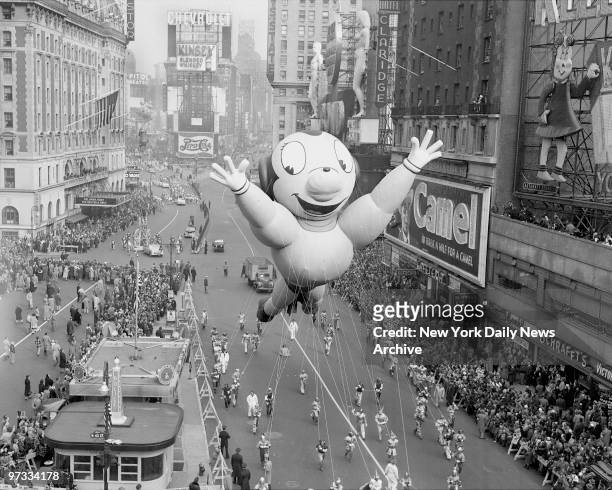 One of characters Mighty Mouse in the annual Macy's Thanksgiving Day parade mugs for the crowd as he hogs the spotlight in Times Square. An estimated...