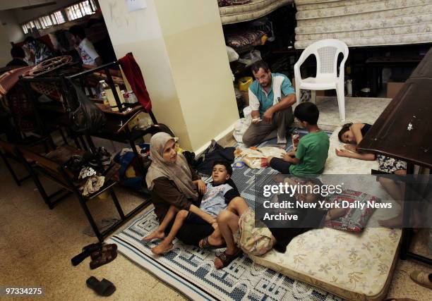 Displaced citizens who have fled bombing in southern Lebanon take refuge at the Amilieh School in downtown Beirut. About 750,000 Lebanese have fled...