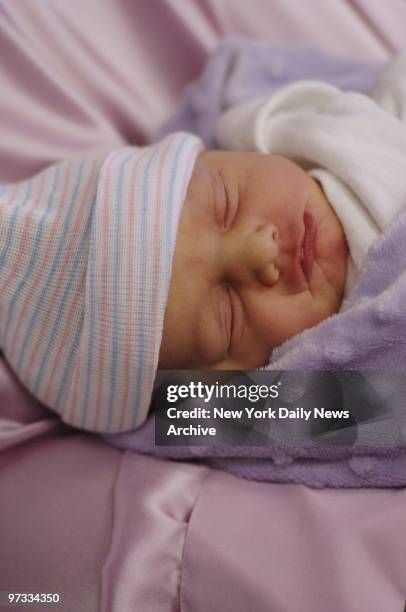 One-day-old Francesca St. James sleeps through her first news conference at Mount Sinai Hospital. Francesca and her brother, Gian, were born...