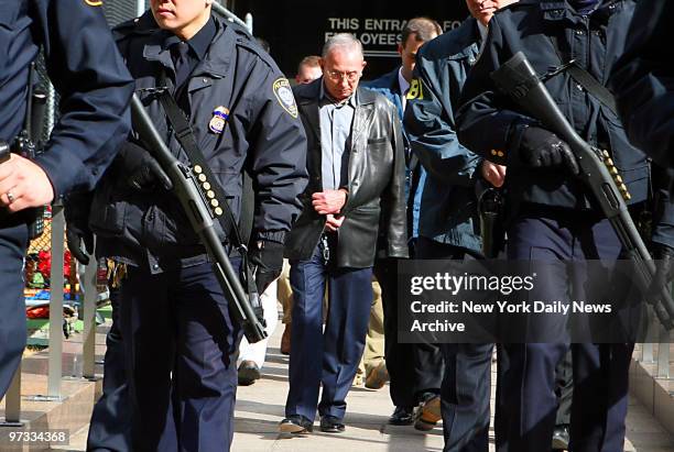 Domenico Cefalu is walked from the FBI's New York Field Office at 26 Federal Plaza, behind a heavily armed police contingent, after the arrests of...