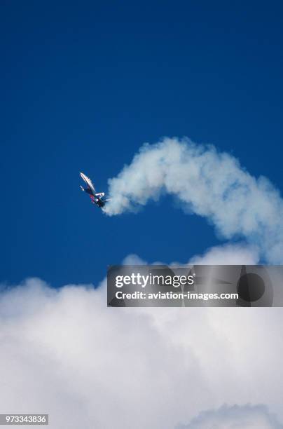 Sukhoi Su-27 Flanker in the flying-display at the 1994 Farnborough Airshow performing the Cobra manoeuvre above clouds with white smoke.