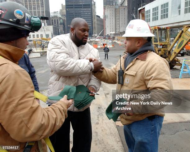 New York Mets Mo Vaughn visits site of World Trade Center terroists attack. Mo Vaughn cheered up workers at ground zero with his visit.