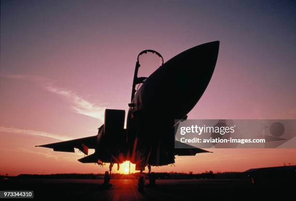 Boeing F-15E Strike Eagle parked at sunset.