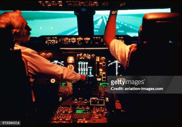 Pilots in a Boeing 747-400 aircraft cockpit-simulator at the Thai International training base in Bangkok, Thailand.