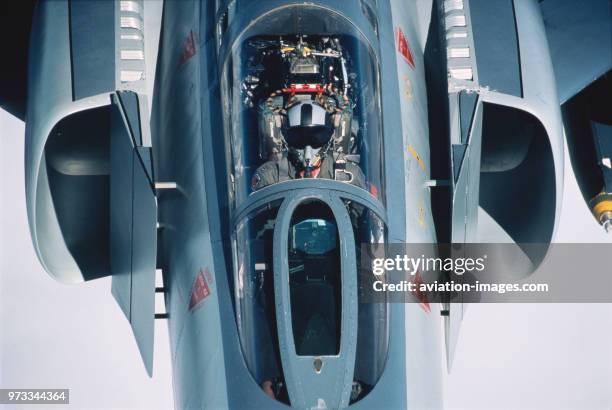 Pilot wearing helmet and oxygen-mask in the cockpit of a USAF 334th Sqn McDonnell Douglas F-4 Phantom.