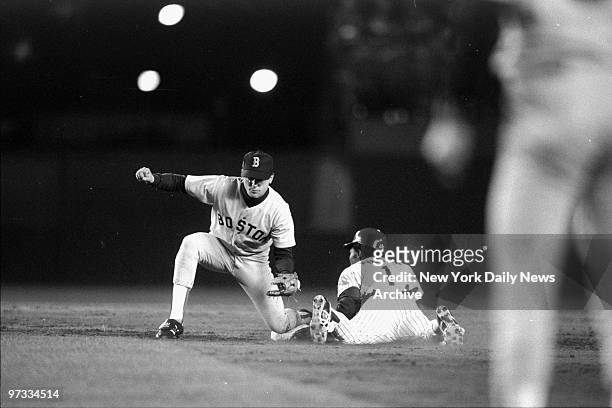 New York Mets' Mookie Wilson steals second base as Boston Red Sox' Spike Owen awaits late throw in third inning. Red Sox defeated the Mets 1-0 in...