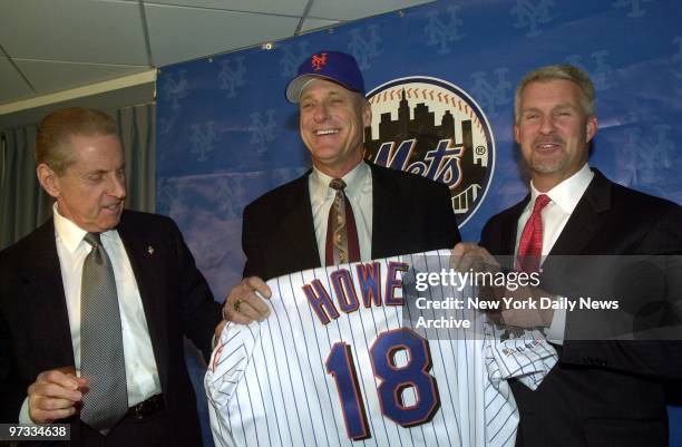 New York Mets' owner Fred Wilpon and General Manager Steve Phillips present Art Howe with his team jersey as they introduce the Met's new manager at...