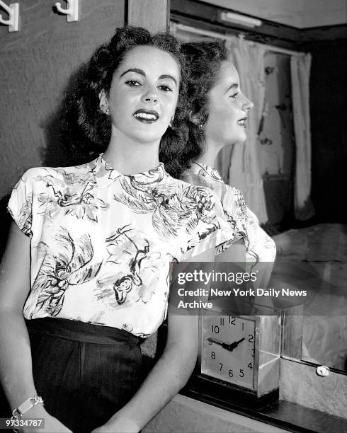 Elizabeth Taylor, who was born in England and who is on her way back there on the Queen Mary to visit her godmother Mrs. William Cadaled. Elizabeth...