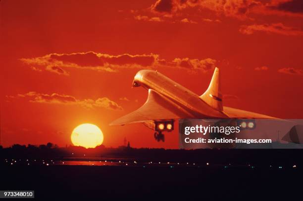Aerospatiale BAC Concorde taking-off on the runway at sunset with runway-lights on, composite-image.