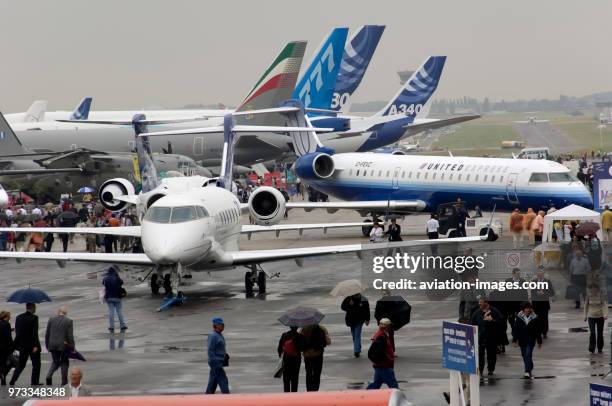 Challenger, Boeing, Airbus and CRJ-700 in an overview of static-display in the rain at the 2005 Paris AirShow, Salon-du-Bourget.