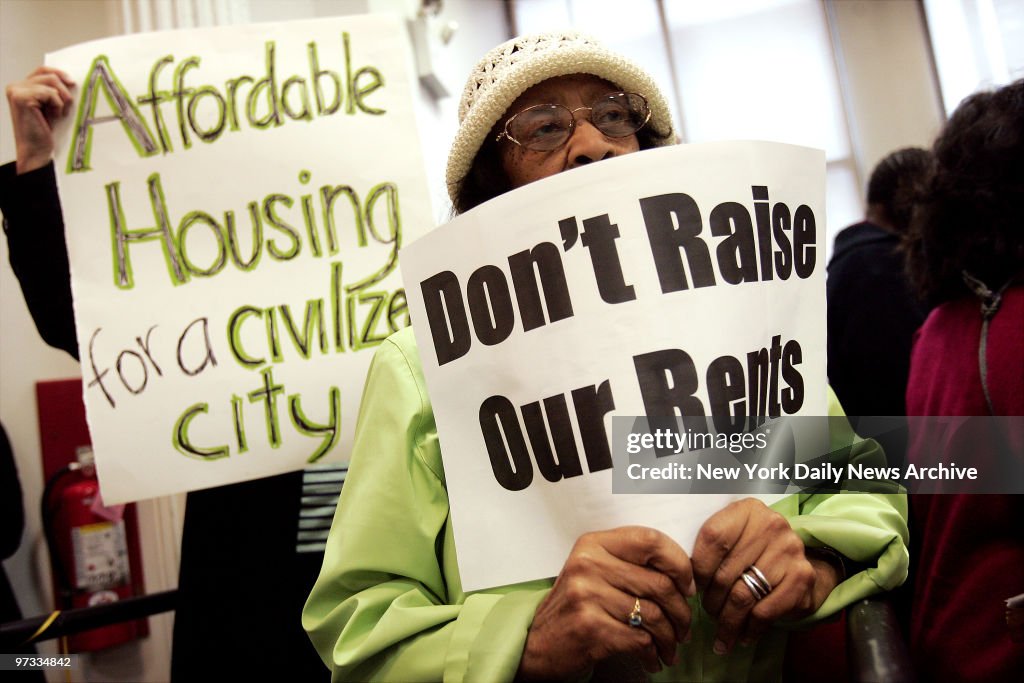 Ella Gordon of Flushing, Queens, holds a sign as she listens