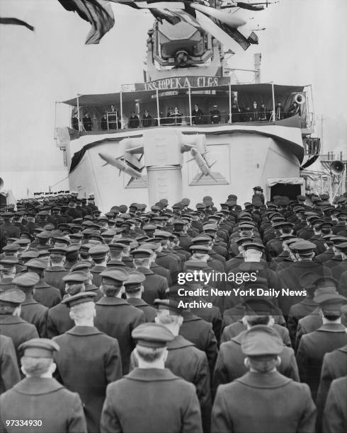 The light cruiser USS Topeka is recommissioned in Brooklyn Navy Yard with an invocation by Chaplain, Commander Edmund W. Pipho, USN as the crew stand...