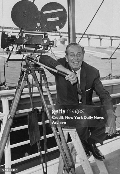 Walt Disney poses aboard the S.S. United States where Disney is making part of the film "Bon Voyage."