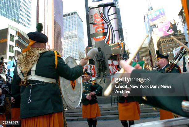 The 28th Infantry Battalion Bagpipe Band from Ireland performs during a wreath-laying ceremony at the Father Duffy Memorial in Times Square to honor...