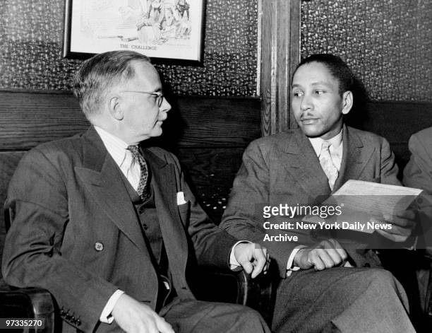 Walter White , secretary of NAACP, talks to Joseph Spell at the NAACP office Fifth Ave.
