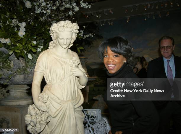 Oprah Winfrey examines a statue on the opening night of the 50th annual Winter Antiques Show at the Seventh Regiment Armory on Park Ave. The...
