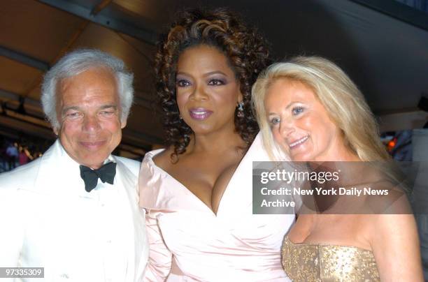 Oprah Winfrey if flanked by Ralph Lauren and wife Ricky as they arrive at the New York Public Library for the 25th annual Council of Fashion...