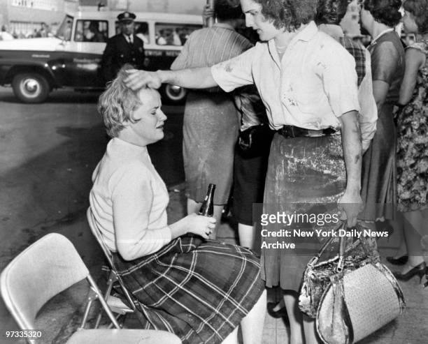 Dolores Groff is comforted by Rosemary Meade after the New York Telephone Company explosion which resulted in a number of deaths.