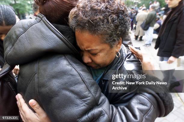 Dolores Wise, the mother of Kharey Wise, one of the five youths convicted in the 1989 Central Park jogger rape case, is comforted at a rally outside...