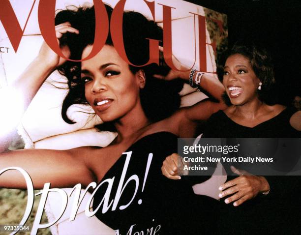 Oprah Winfrey seems to approve of blowup of her picture on the cover of Vogue's October issue at party at Balthazar.,