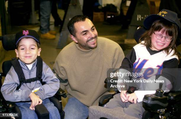 New York Mets' pitcher John Franco shares a laugh with March of Dimes children Christian Ponisi and Megan Ajello at the Rescue 5 fire company on...