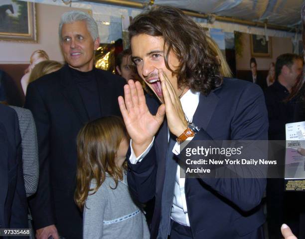 Orlando Bloom jokingly screams back at fans lining the entrance of the Loews Lincoln Square theater as he arrives for the New York premiere of the...