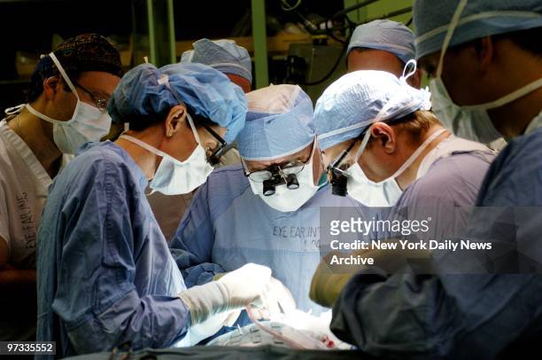 Doctors Elizabeth Maher, Robert Della Rocca and David Della Rocca perform reconstructive eye surgery on Anna Kadalaeva at the New York Eye and Ear...
