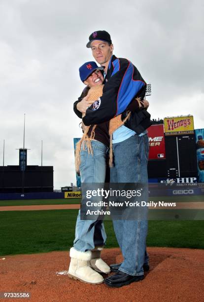 New York Mets' pitcher Kris Benson warms up with his wife, Anna, on the pitcher's mound at Shea Stadium. Benson has signed on for a new $22.5 million...