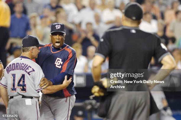 Washington Nationals' manager Frank Robinson yells at home plate umpire Jeff Nelson in the sixth inning at Shea Stadium after Nelson ejected him from...