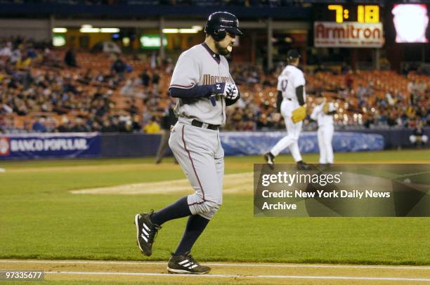 Washington Nationals' Nick Johnson takes first base after walking in the first inning against the New York Mets at Shea Stadium. The Mets went on to...