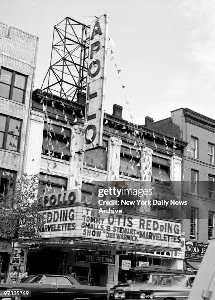 The Apollo Theater in Harlem. Otis Redding, Billy Stewart and the Marvelettes are shown on the marquee.