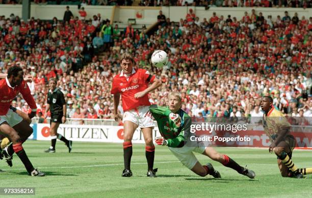 Manchester United goalkeeper Peter Schmeichel and Steve Bruce of Manchester United in action during the FA Charity Shield at Wembley Stadium on...