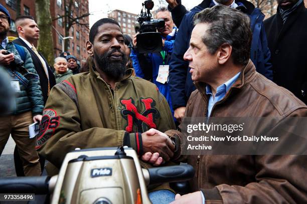 New York Governor Andrew Cuomo, right, greets New York City Housing Authority Andrew Jackson Houses resident Jeffrey Blyther on Monday, March 12,...