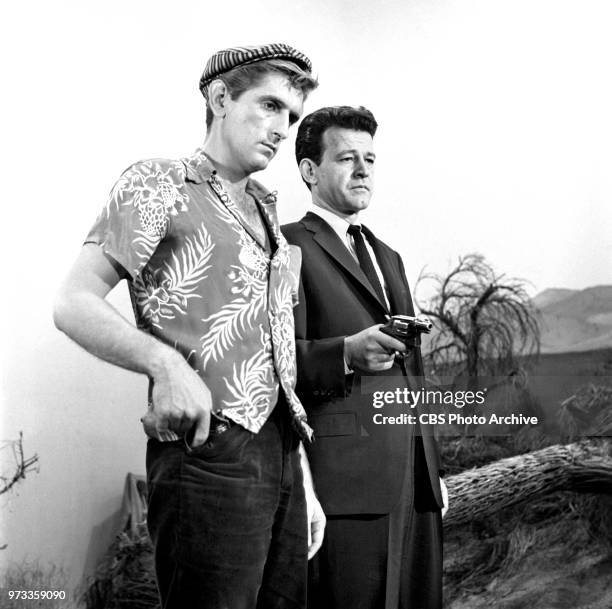 Television series, Alfred Hitchcock Presents. Episode, Escape to Sonoita. Pictured from left is Harry Dean Stanton and Murray Hamilton . Originally...