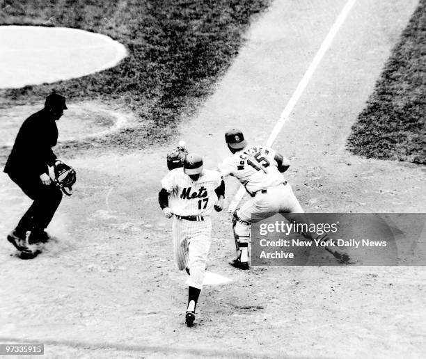 New York Mets' Rod Gaspar scores after Wayne Garrett popped a foul down the third base line. St. Louis Cardinals' third baseman Mike Shannon caught...