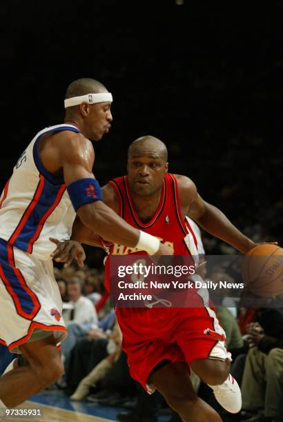 The Atlanta Hawks' Antoine Walker is guarded by the New York Knicks' Jerome Williams in a game at Madison Square Garden. The Knicks won, 104-88, to...