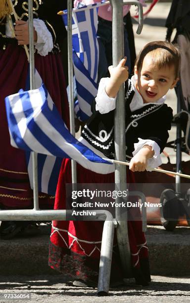 Ourania Kalergios waves a Greek flag as he watches the Greek Independence Day Parade along Fifth Ave.