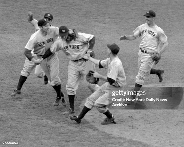 Out in center field, Joe DiMaggio has just made the last put out of the 1941 World Series, and her in the middle of the diamond the Yankee infield...