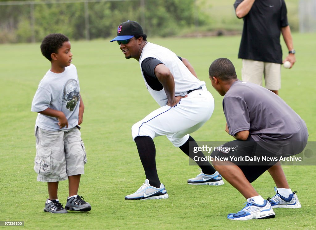 New York Mets' pitcher Pedro Martinez has some fun with rela