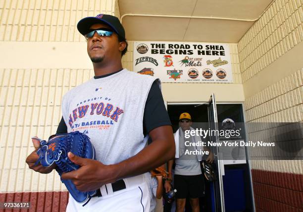 New York Mets' pitcher Pedro Martinez walks out of the clubhouse at Tradition Field for a training session where he threw off a mound for the first...