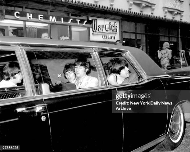 The Beatles leave Hotel Warwick in a limousine for Shea Stadium.