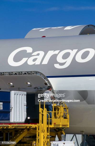 Cargo being loaded into front side cargo door of an Asiana Airlines Boeing 767-300EF.